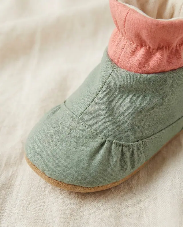 A finished baby booties sewn from the Sewzy pattern, view 3
