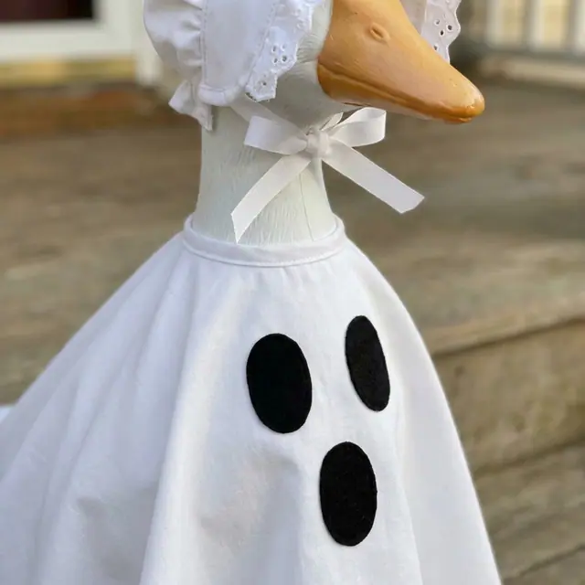 A porch goose wearing the ghost outfit, view 3