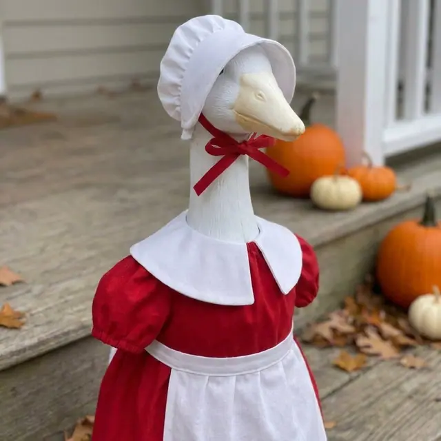 A porch goose wearing the Mrs Claus outfit, view 3