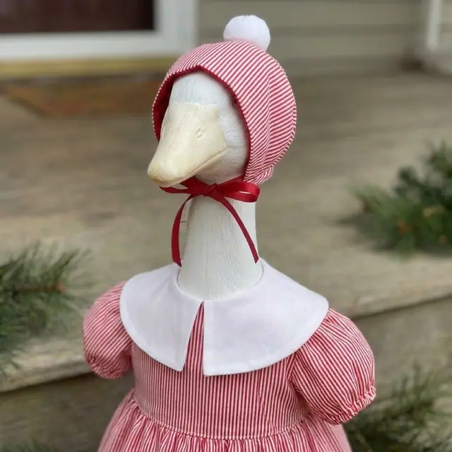 A porch goose wearing the pajamas outfit, view 3