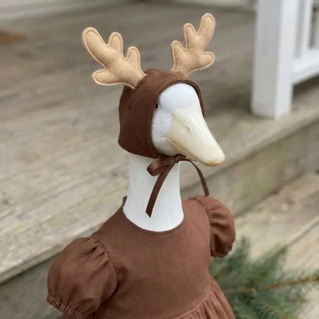 A porch goose wearing the reindeer outfit, view 3