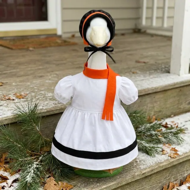 A porch goose wearing the snowman outfit