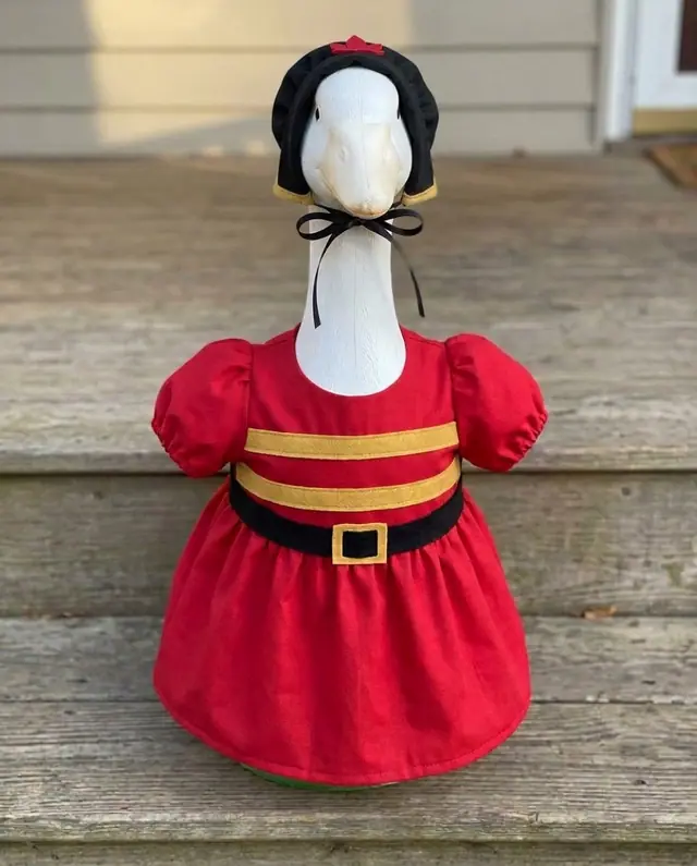 A porch goose wearing the toy soldier outfit