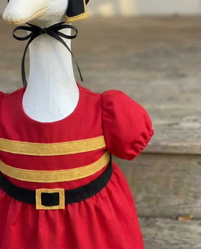 A porch goose wearing the toy soldier outfit, view 3