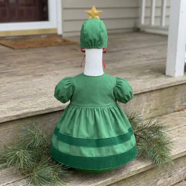 A porch goose wearing the Christmas Tree outfit, view 2