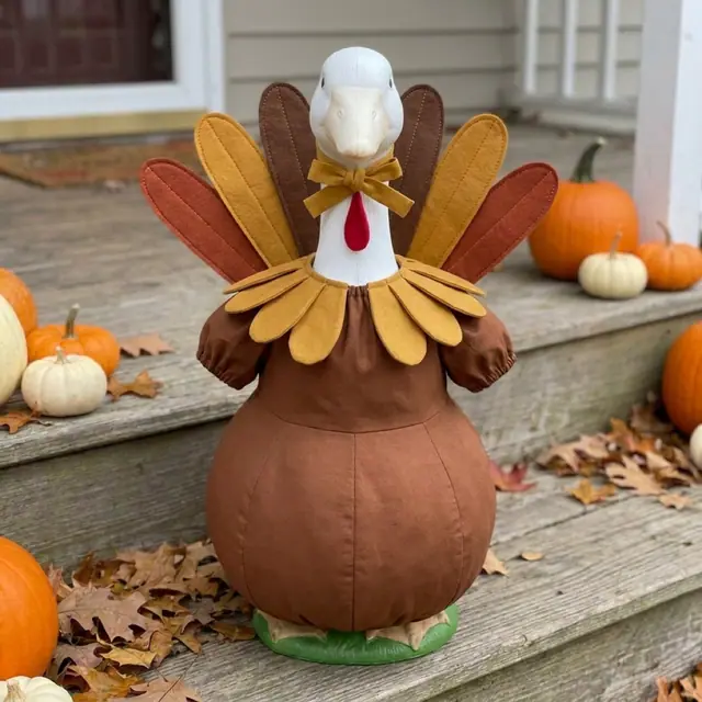 A porch goose wearing the turkey outfit