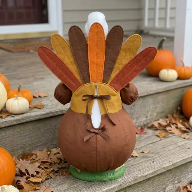 A porch goose wearing the turkey outfit, view 2