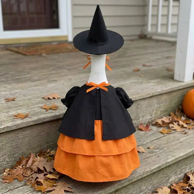 A porch goose wearing the witch outfit, view 2