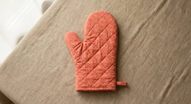 A finished oven mitt sewn from the Sewzy pattern
